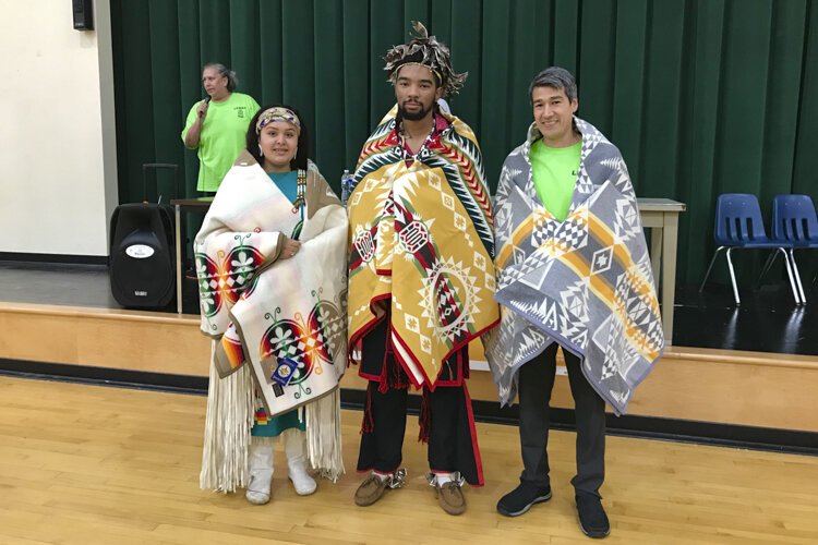 Graduates receiving blankets from LENAC at the 2019 Pow Wow.